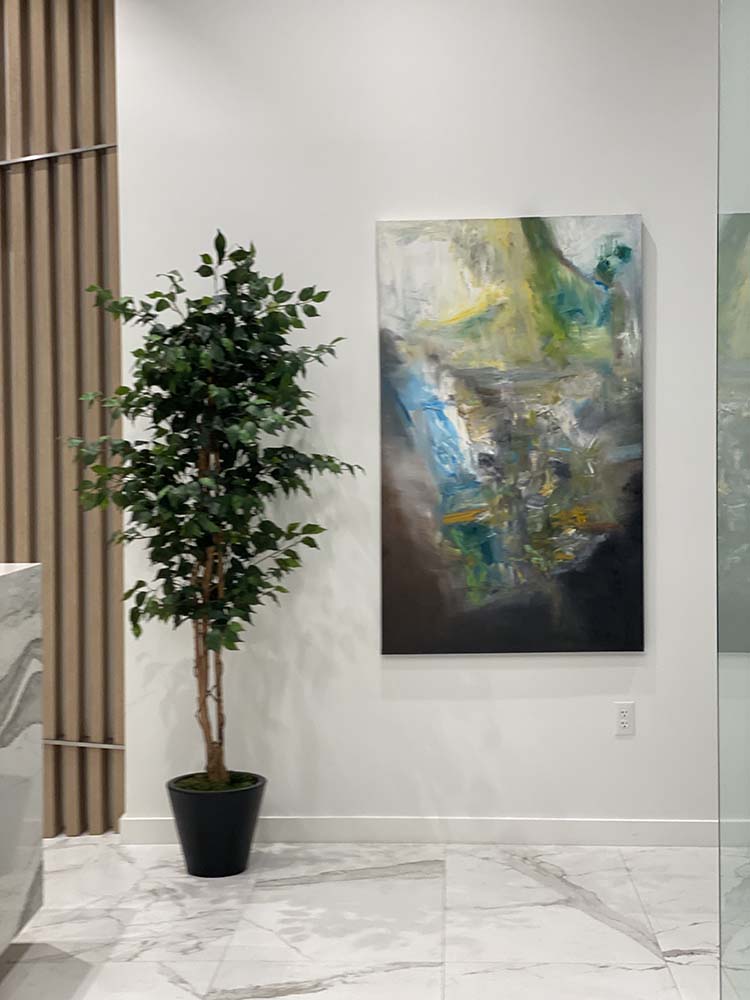 A large original abstract by Red on a white wall in a marble-floored professional lobby