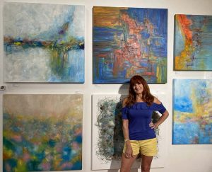 Red posing with her Abstracts at the Hub
