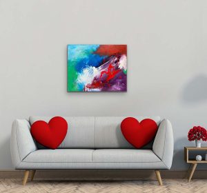 The Spell of Red Abstract by Red hung over white couch with Red heart pillows