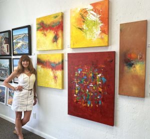 Red with Her Artwork 