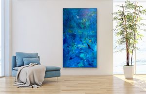 Calming Seas large acrylic abstract on gallery wrap canvas hung on white wall near light blue chair
