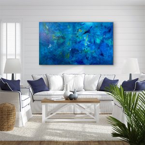 Calming Seas large acrylic abstract on gallery wrap canvas hung on white wall over white couch trimmed in blue